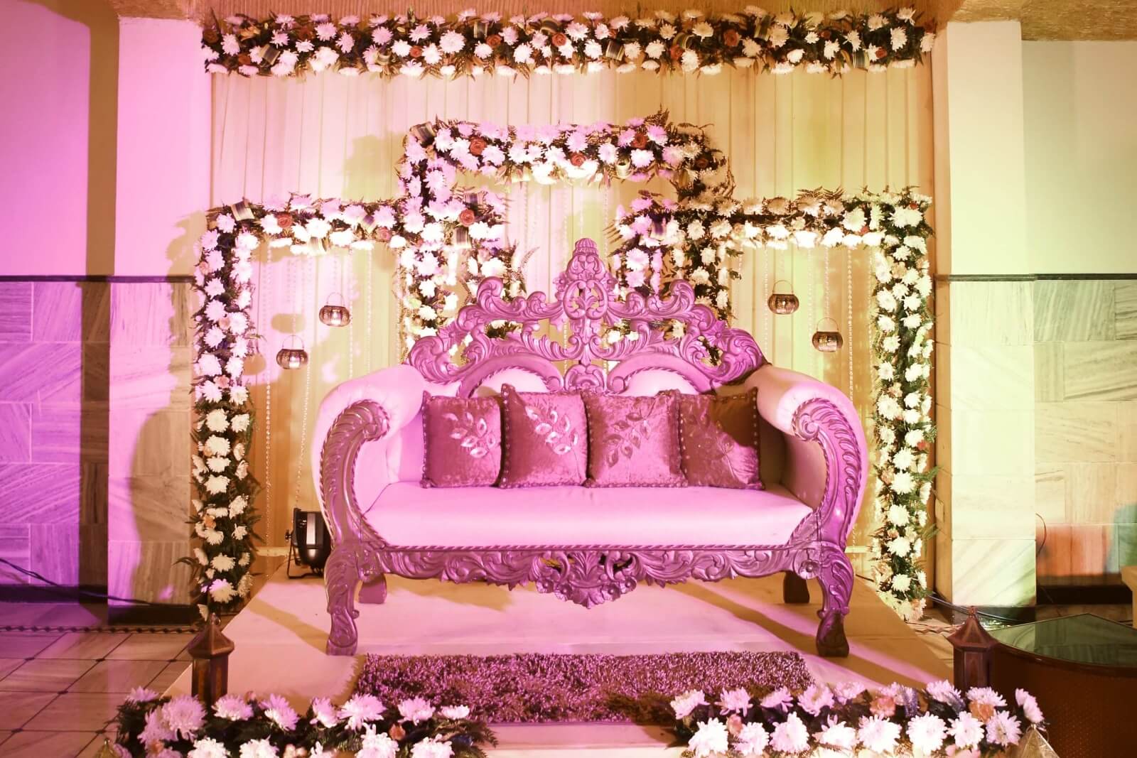 eautifully decorated wedding stage with luxurious seating and floral arrangements at EllBee Ganga View, Rishikesh, perfect for capturing memorable moments.